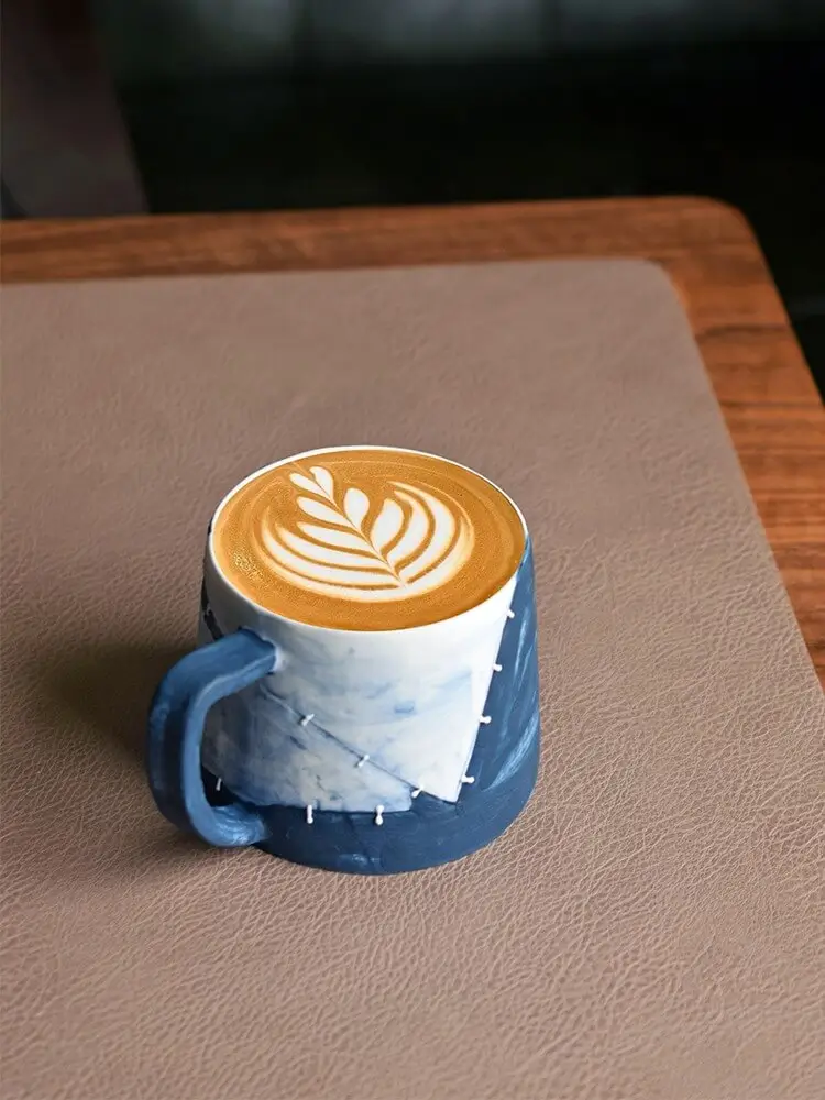 Latte mug designed for perfect milk art, with a wide mouth and smooth ceramic surface.