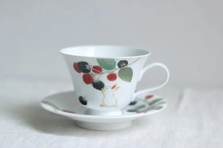 Custom handmade ceramic mug and saucer set with personalized design, eco-friendly and artisan-crafted