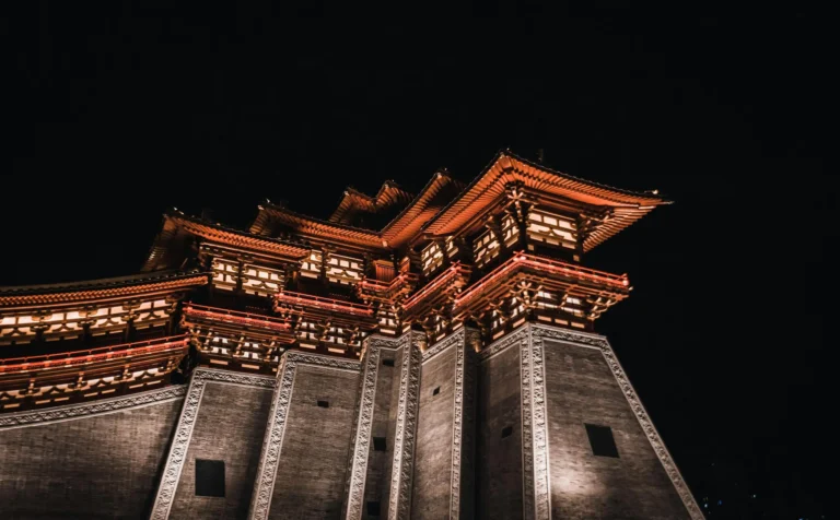 Night view of the brightly lit imperial palace for The Tongzhi Wedding background