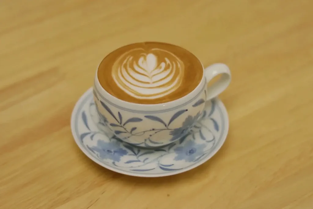 Handmade wide-mouth ceramic mug designed to enhance latte art presentation
