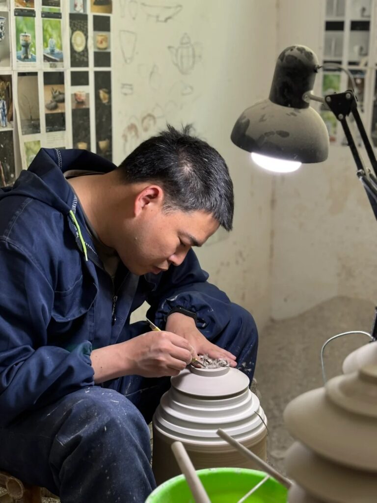 Handmade pottery being trimmed by a ceramic artist for a refined finish